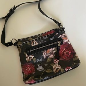Floral leather shoulder bag.